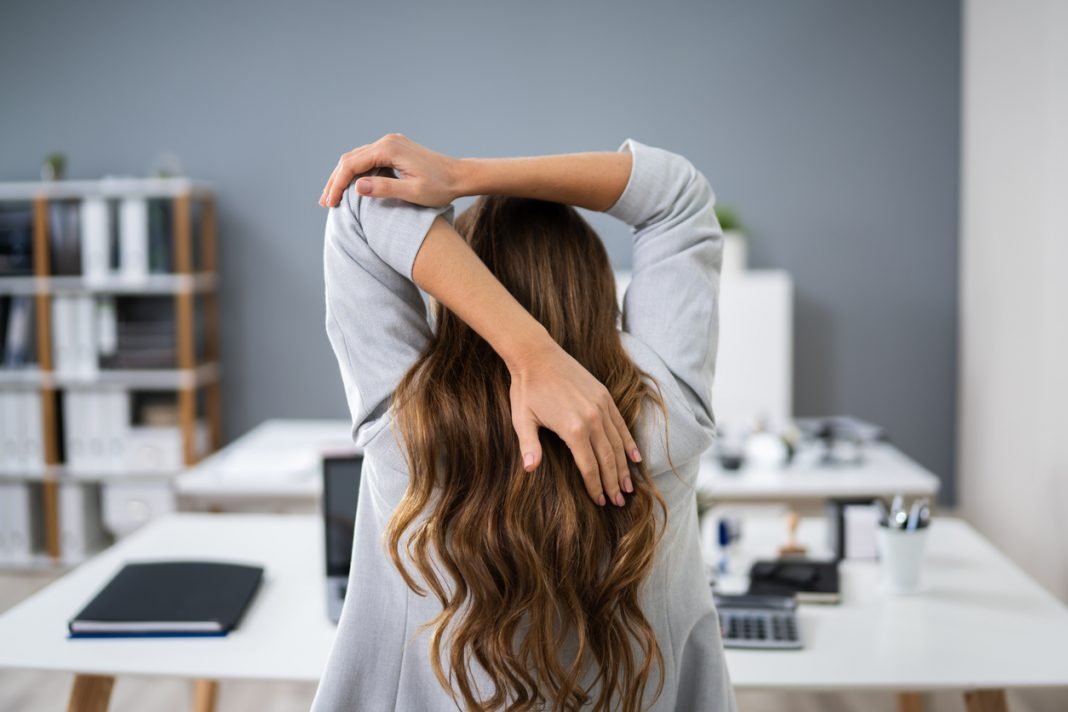 Businesswoman Stretching Her Arms